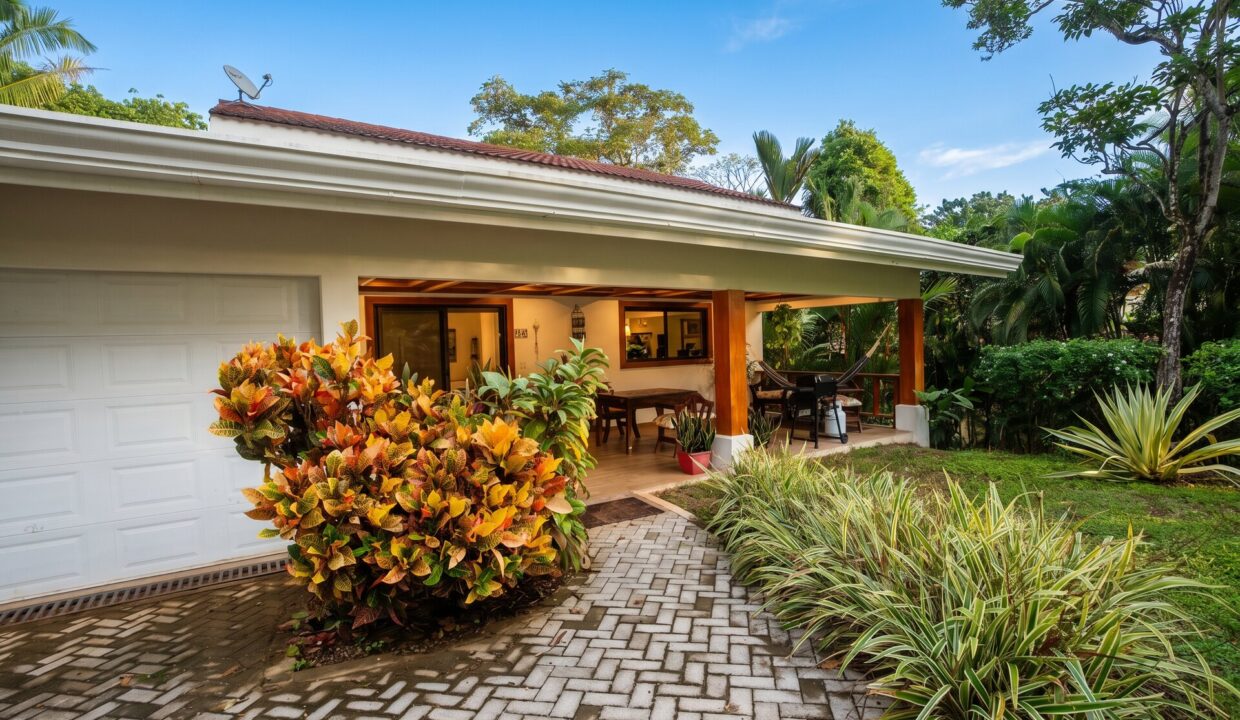 Tropical Eden — entrance crotons driveway