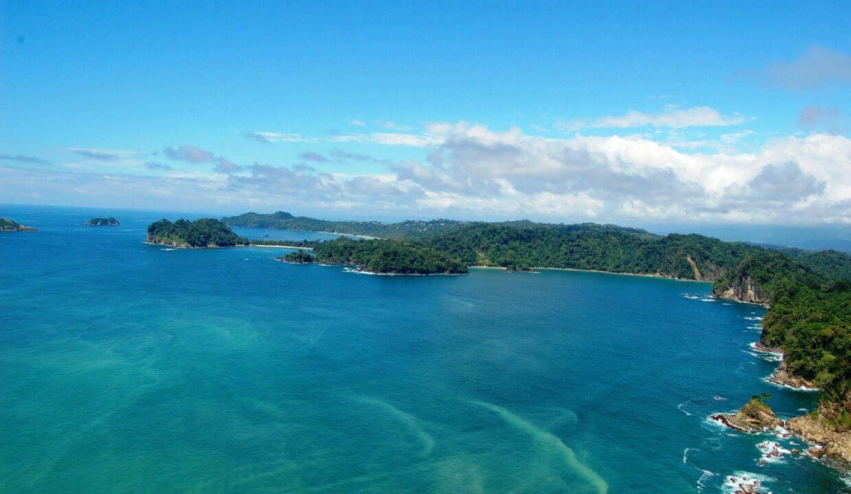 Aerial of the Manuel Antonio coastline with islands and white-sand coves, Quepos, Costa Rica