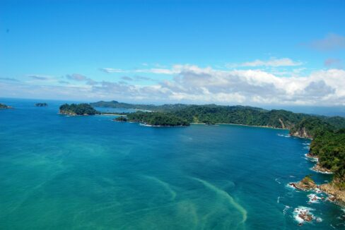 Aerial of the Manuel Antonio coastline with islands and white-sand coves, Quepos, Costa Rica