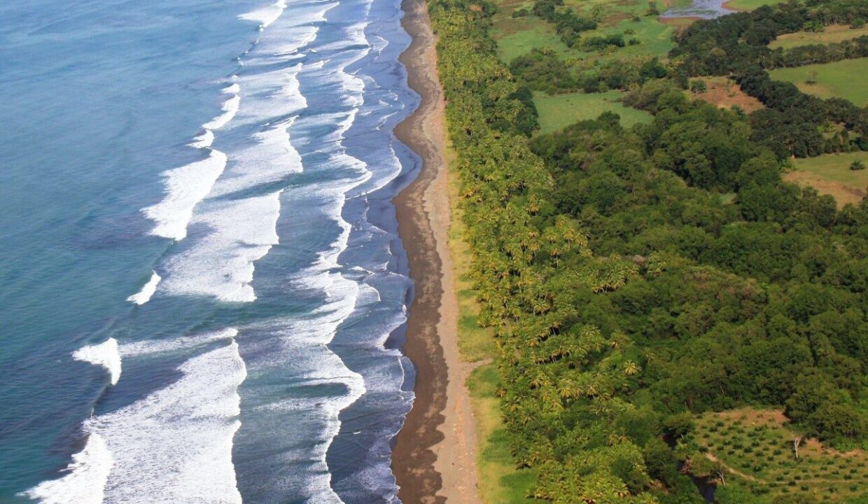 Aerial of the long surf line along Playa El Rey on Costa Rica's South Pacific coast