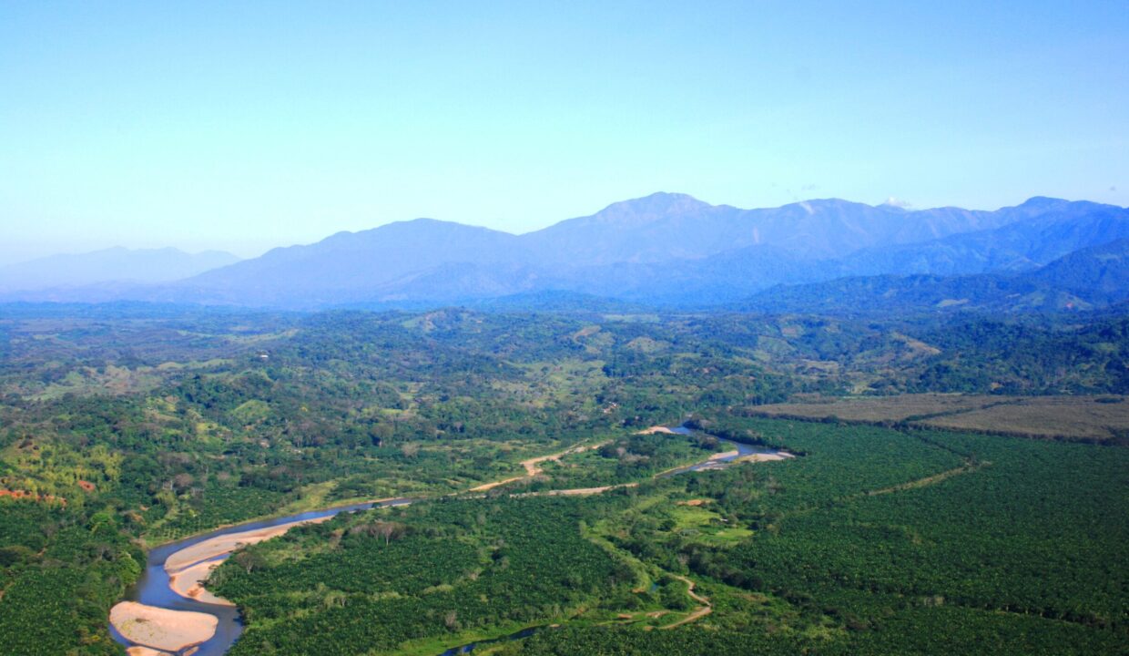 Green river valley framed by the Talamanca foothills near Quepos, Costa Rica