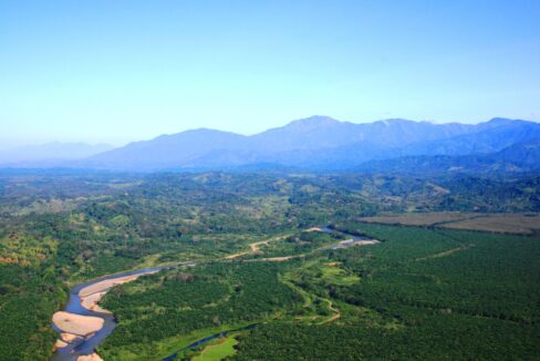 Green river valley framed by the Talamanca foothills near Quepos, Costa Rica