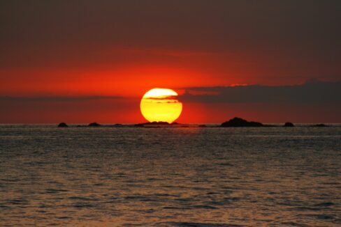 Golden-red Pacific sunset over the ocean near Playa El Rey, Quepos, Costa Rica