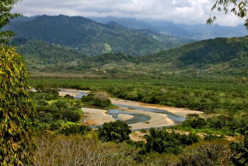 Green valley, river and Talamanca mountains seen from the Lomas del Rey land, Quepos